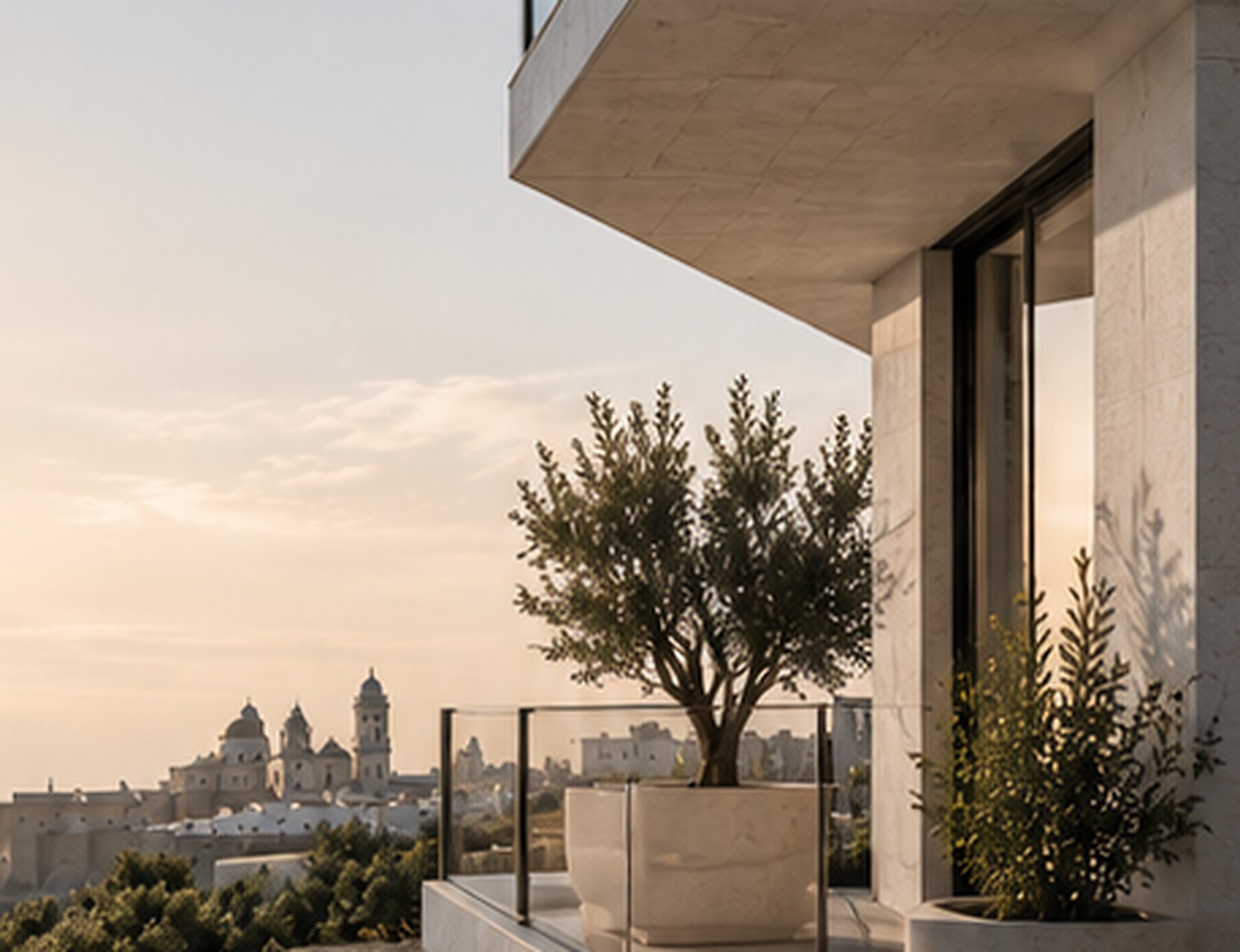 Edificio contemporáneo con un olivo y vistas a Cádiz
